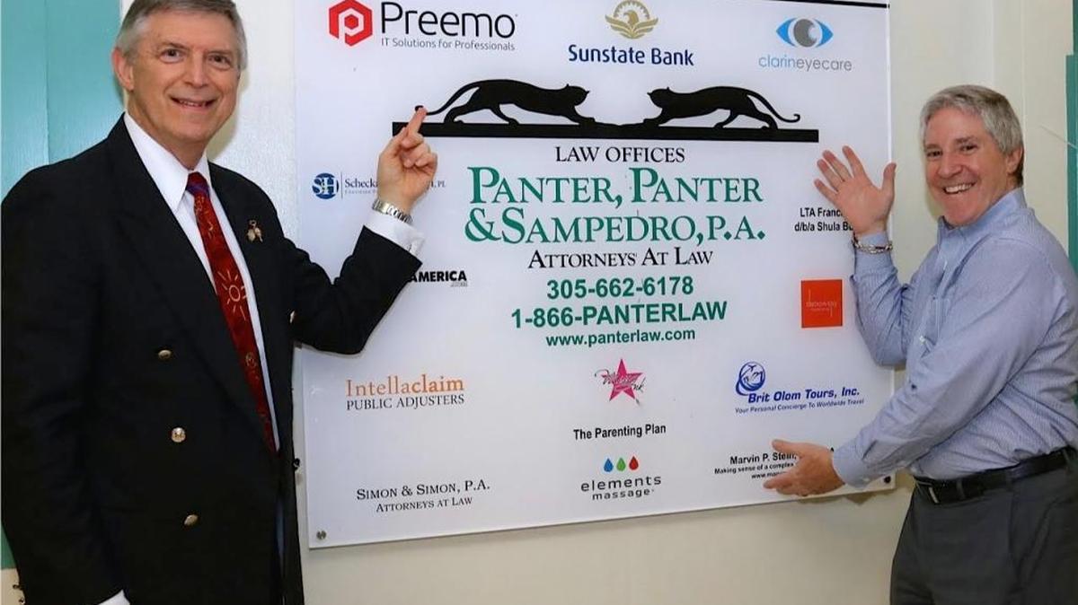 Miami-Dade School Board Vice Chairman Larry Feldman and Mitchell Panter, managing partner of Panter, Panter & Sampedro, P.A., celebrate the ribbon-cutting ceremony of the new computer lab at Palmetto Middle School.