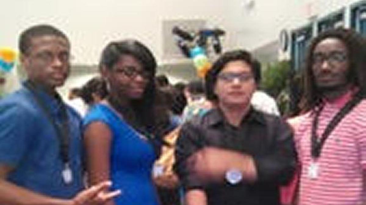 
IHAD-Overtown Dreamers attending 2015 Take Stock In Children's Ceremony at Miami Dade College Wolfson Campus. From left, Milton Stubbs, Sendy Joseph, Alejandro Castro and Malik Williams.
