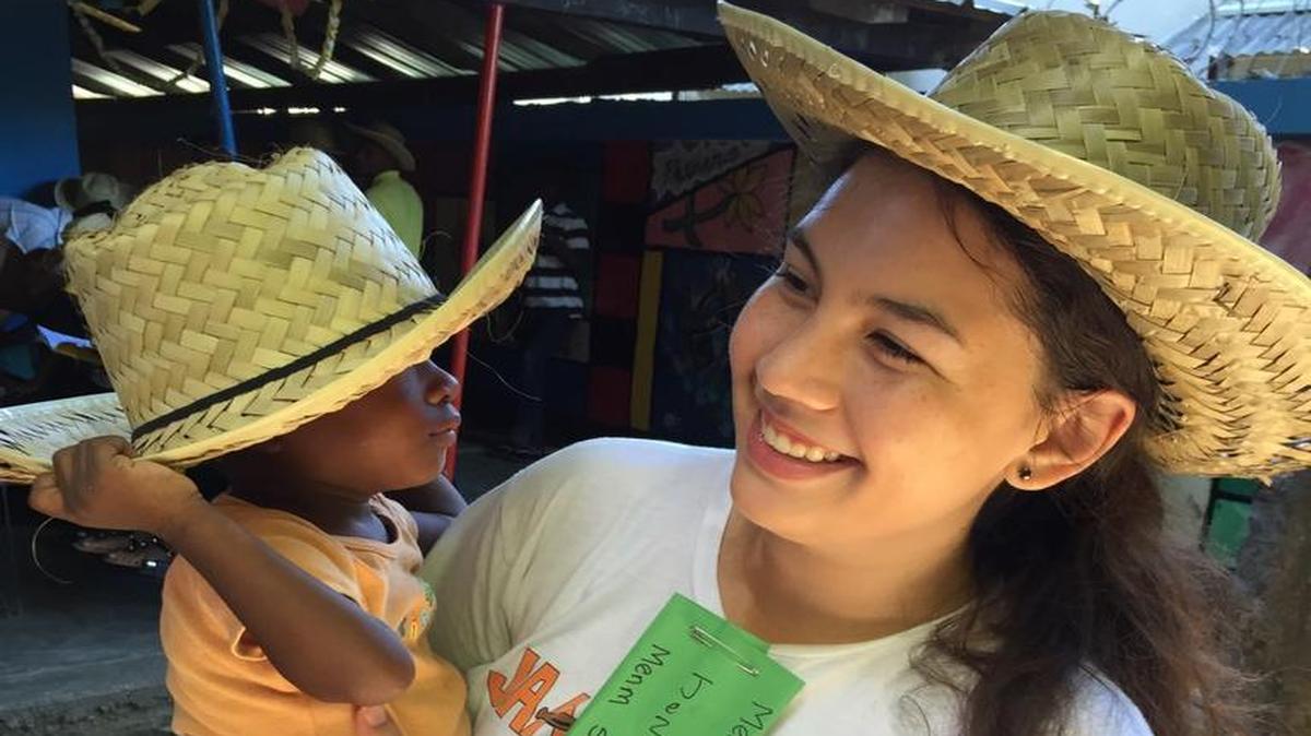 At the House of Hope orphanage in northwest Haiti, Dr. Michael M. Krop Senior High School senior Sabrina Dillon holds special patient, 3-year-old Mitts, who weighed only 2 pounds at birth.