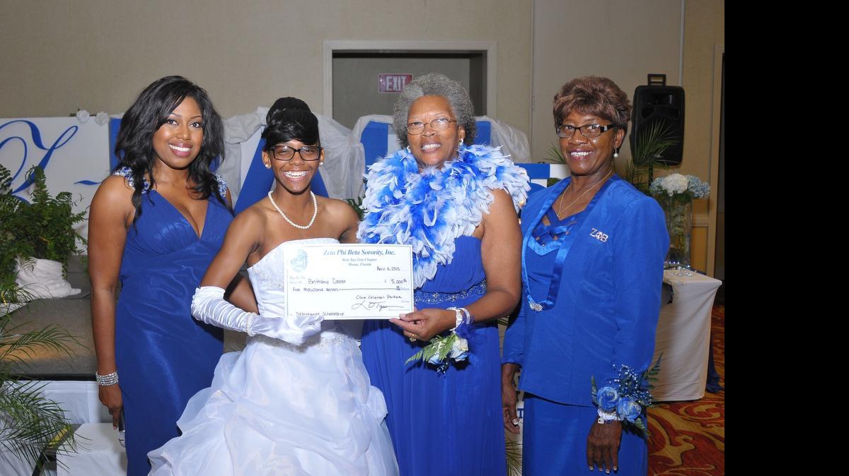 
2015 Z-Ball debutantes and sponsors pictured from left to right are : Lourvenante Tyson, scholarship committee chairperson; $5,000 Scholarship Award recipient Zeta Debutante Brittany Moesha Cooper; President Cora I. Coleman Portee; and Johnnie Mae Kerr, treasurer.
