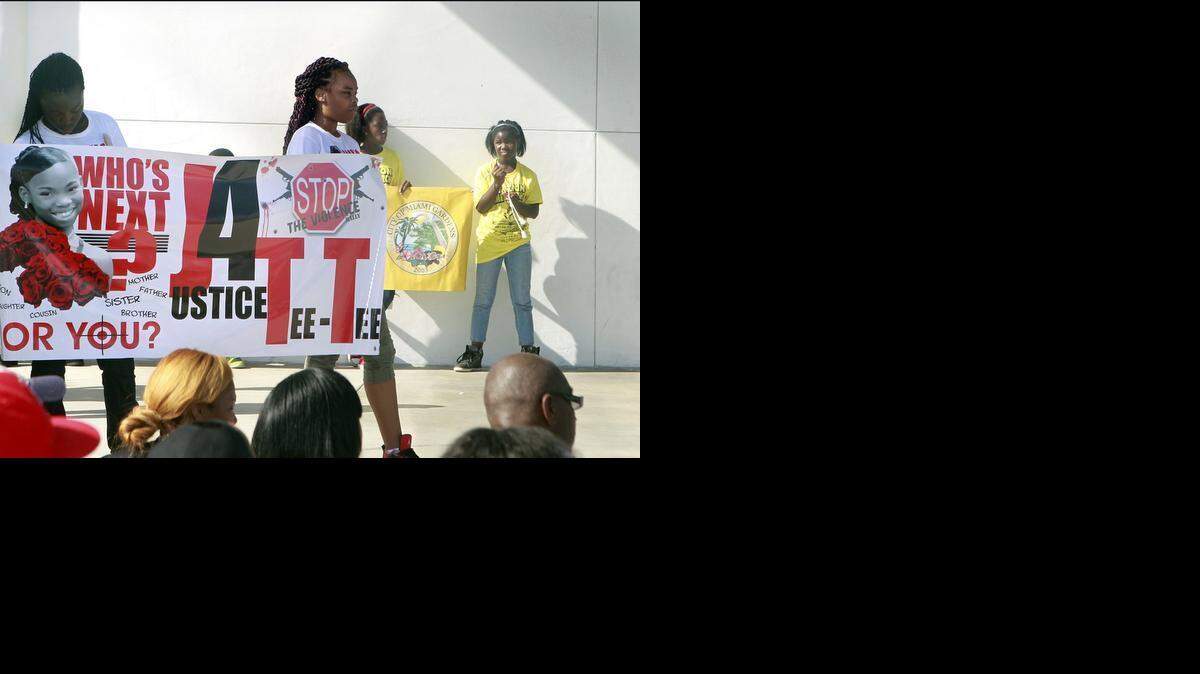 
In 2013: Daresha Pender, 14, left; and Alize Forshee, 14, hold a banner in memory of Daresha's step-sister and Alize's sister, 12-year-old Tequila Forshee, killed Aug. 15 by gunshots fired into her grandmother's Miami Gardens. Tequila was among those remembered on Saturday, Sept. 14, 2013 during the Miami Gardens Christian Community Against Crime's "Prayer Rally" at the Betty T. Ferguson Center, 3000 NW 199th St. There, hundreds of people gathered to pray for an end to violent crimes and gang activity in the city.
