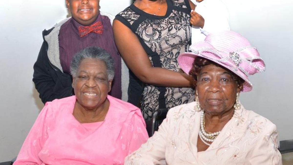 At the J. Kenneth Major Parish Hall, Church of the Incarnation: Seated, Harbour Island cousins Delores Johnson, Tampa and Miami reunion founder, Lena Elma Higgs Canty; standing, Arnold J. McNeal and Makia Curry, holding daughter Asaya Aimee-Bonnee.
