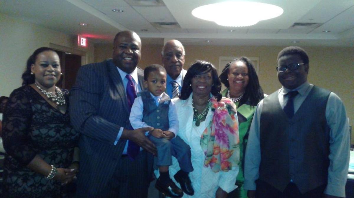 The Robinson family, from left: Nichole Coleman Robinson; Freddie Robinson Jr. holding Freddie Robinson III; Susie Robinson, Ed.D.; LaFreda Robinson Smith, PharmD.; Noah Smith Jr. Freddie L. Robinson Sr. stands behind the rest of the family.