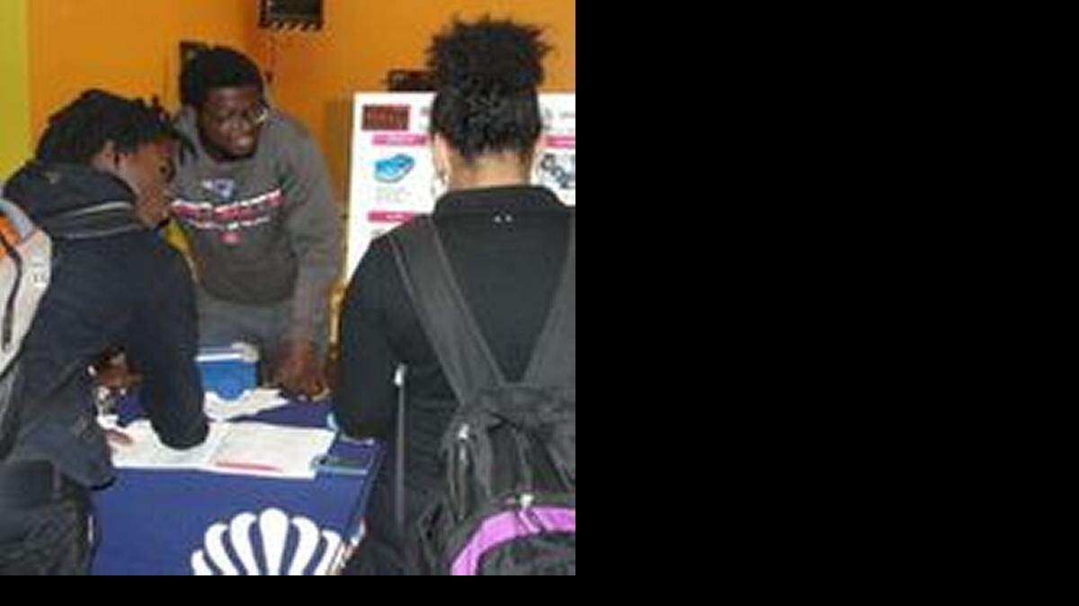 
Booker T. Washington High School students learned about real-life money management through Mad City Money. These teens work at the student-run branch of Dade County Federal Credit Union at the high school.
