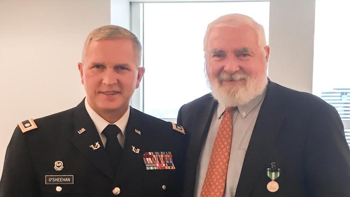 Attorney and Lt. Col. Edward O'Sheehan, left, presented fellow Shutts & Bowen Partner Stephen Maher with the Florida Commendation Medal.