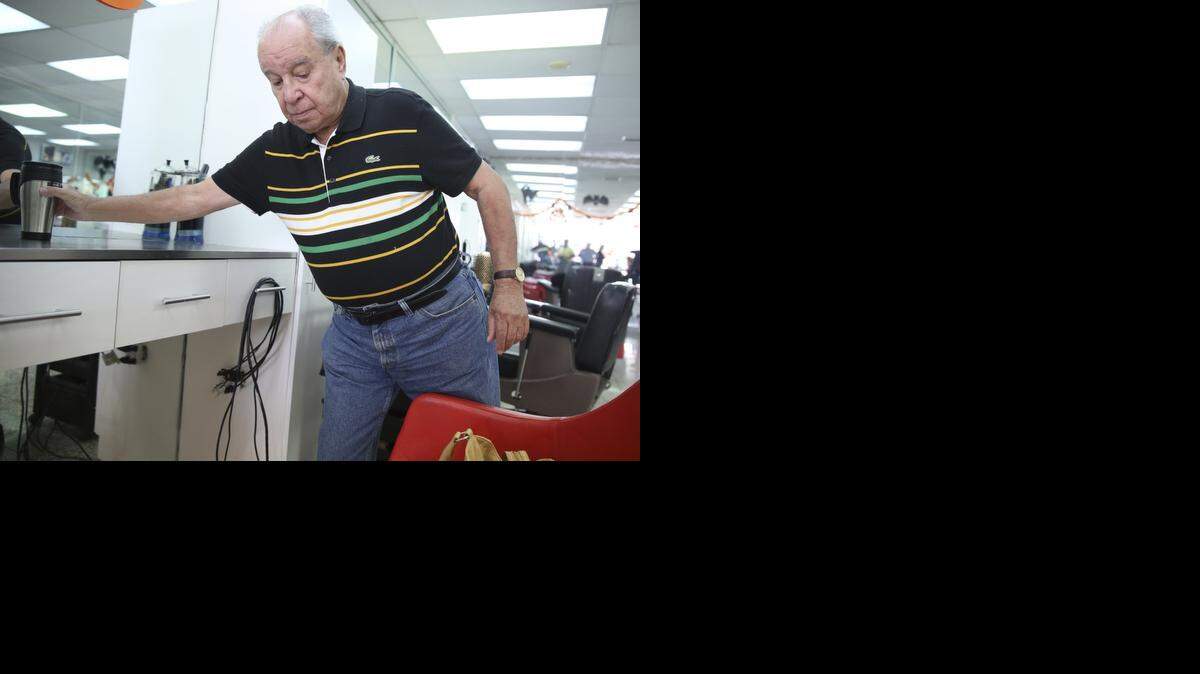 
Cuban Barber Raul Cortada retired after 52 years of Barbershop work. He is shown at Red Bird Salon on Wednesday, October 15, 2014.
