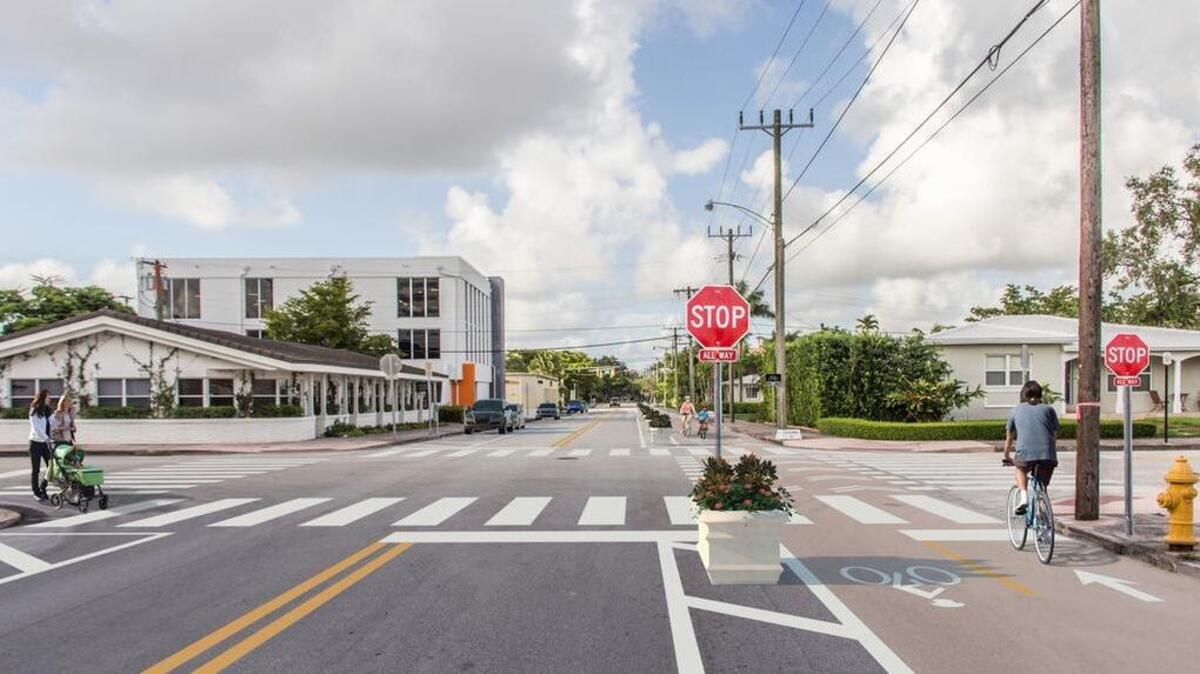 Rendering of the short-term plan for installing bike lanes on Salzedo Street, which includes installing plant boxes. The city is launching a pilot program called “Gables Greenways” where plants and green space will serve as a buffer between the bike lanes and car lanes.