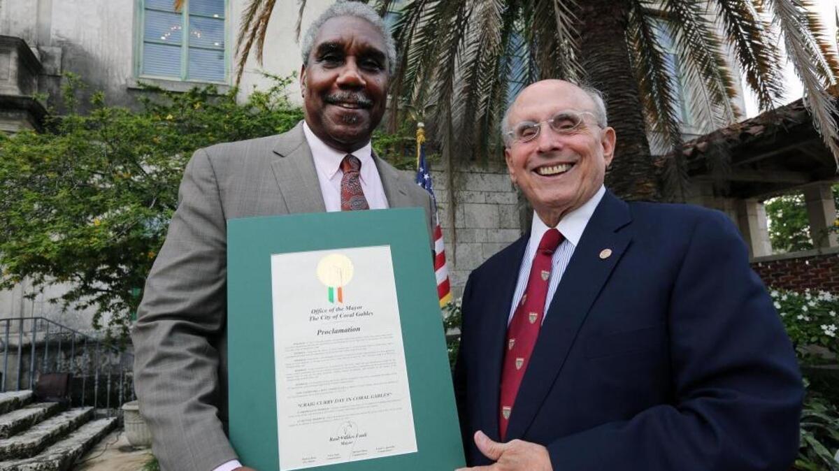 Left to right, Craig Curry and Mayor Raul Valdes-Fauli, as the city proclaims June 13 as "Craig Curry Day."