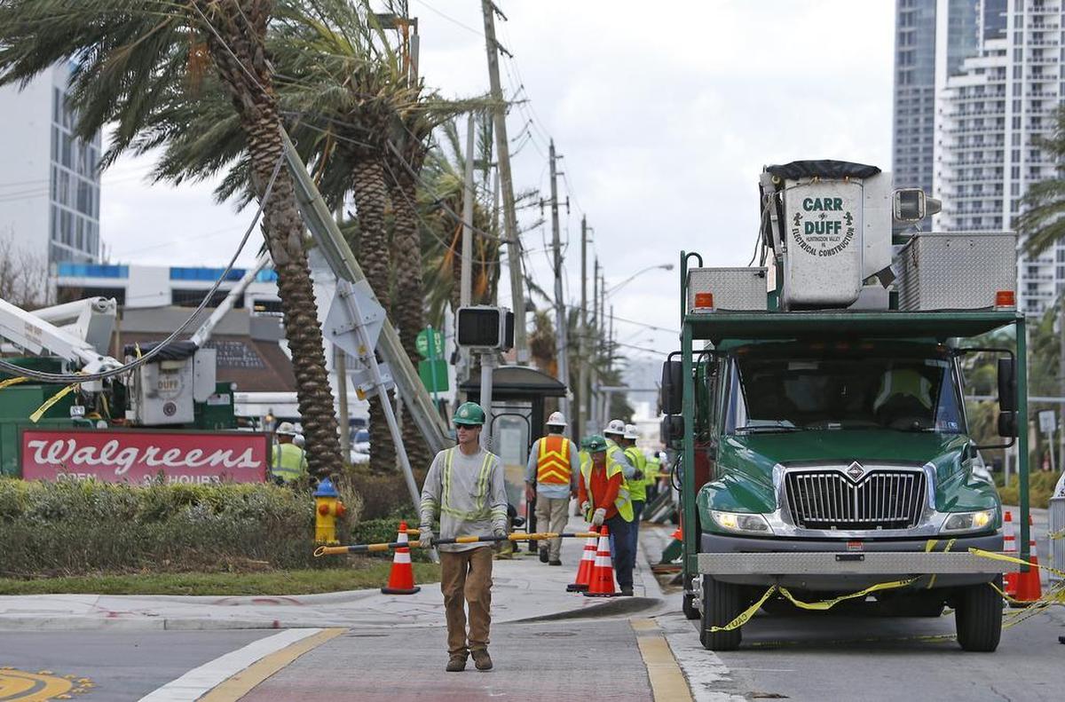 Carr & Duff Electrical Construction, working with FPL, reconnects a main power line in Sunny Isles Beach in the aftermath of Hurricane Irma.
