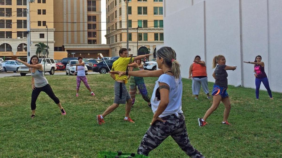 Participants take part in a zumba class as part of the ongoing Coral Gables Wellness Wednesdays event on Miracle Mile.