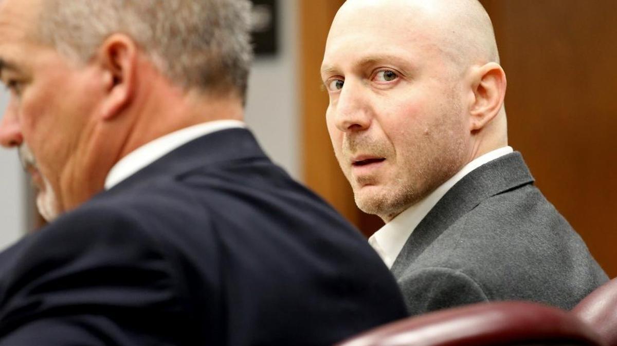 Adam Barnett, right, sits next to his attorney Elio Vasquez, as he appears in court accused of trying to hire a hit man to kill his underage sex victim as well as his former defense lawyer David Seltzer.