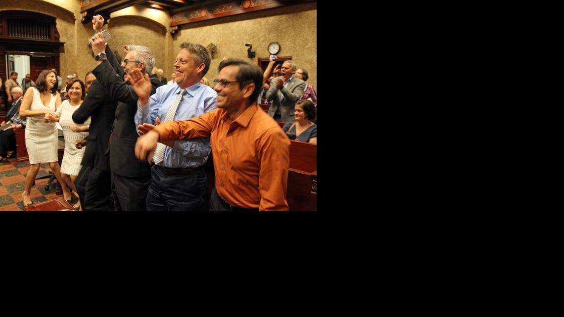 
Couples react in court after Judge Sarah Zabel lifted a legal stay to allow same-sex marriages in Miami-Dade County. The couples shown who had challenged the wedding ban are, from left to right: Catherina Pareto and Karla Arguello; Jeff and Todd Delmay (obscured); David Price, whose partner was not present; and Don Johnston and Jorge Diaz.
