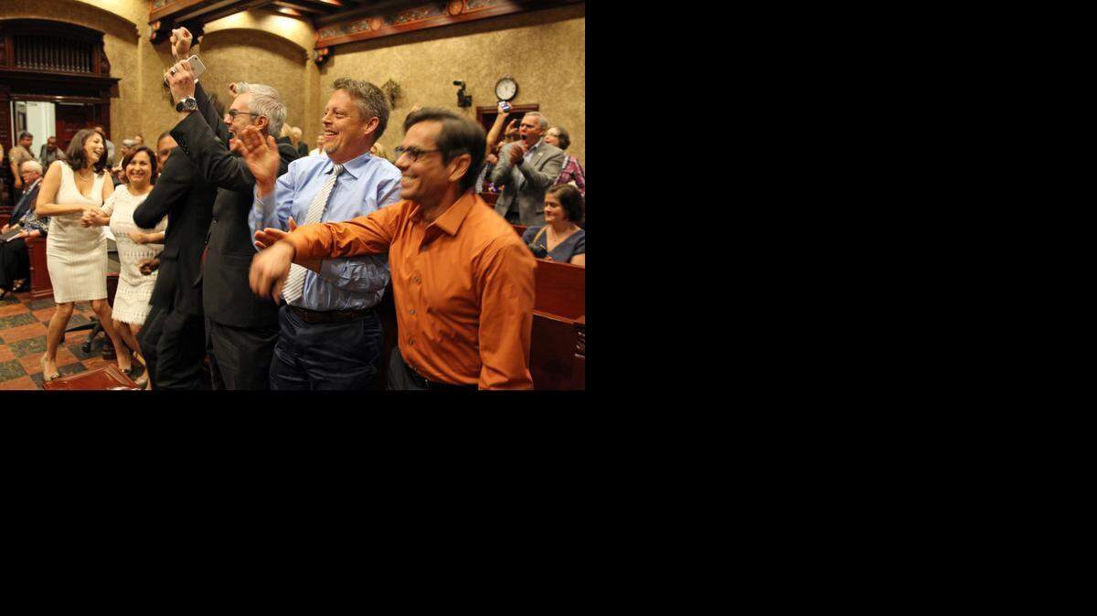 
Couples react in court after Judge Sarah Zabel lifted a legal stay to allow same-sex marriages in Miami-Dade County. The couples shown who had challenged the wedding ban are, from left to right: Catherina Pareto and Karla Arguello; Jeff and Todd Delmay (obscured); David Price, whose partner was not present; and Don Johnston and Jorge Diaz.
