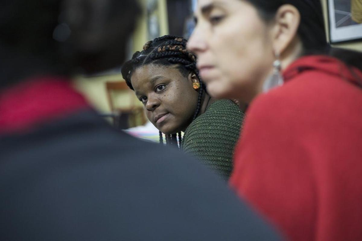 Jasmeen Rogers, center, participates in a Women’s Circle gathering at the Miami Workers Center to share tales of abuse as a path toward healing.