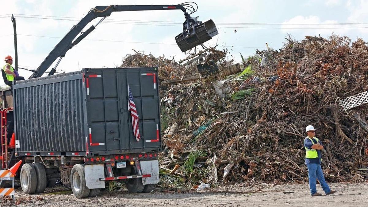 September file photo of a staging site where crews pick up debris from Hurricane Irma in Hialeah.