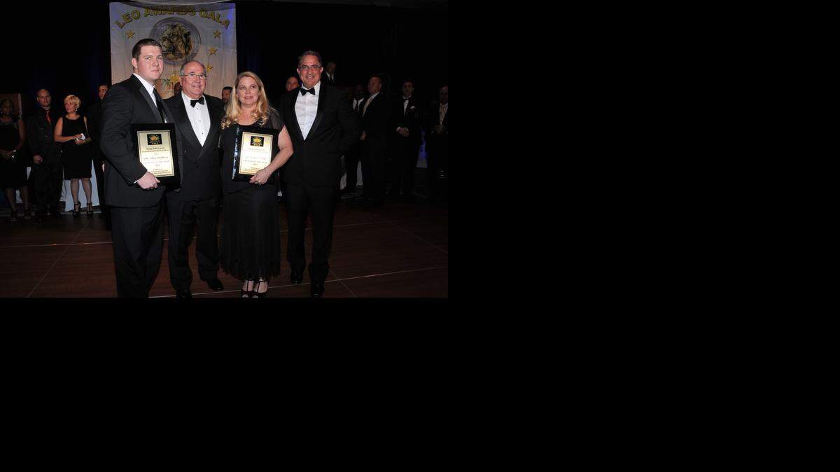 
Honored: Officer John Childress, Sunny Isles Beach Police Chief Fred Maas, officer Tracey Cabal and Miami-Dade County Association of Chiefs of Police President Charles Press.
