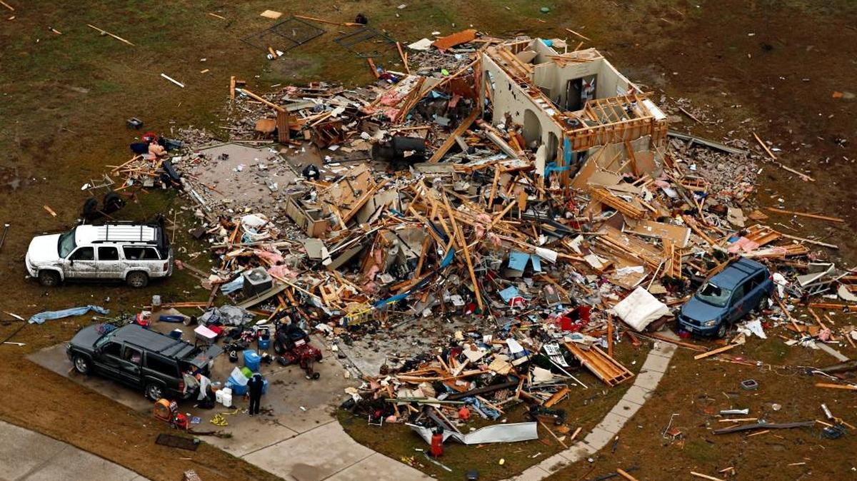 This aerial photo shows a damaged home after a tornado ripped through the area, Monday, Dec. 28, 2015 in Texas. Residents surveyed the destruction from deadly tornadoes in North Texas as the same storm system brought winter woes to the Midwest on Monday, amplifying flooding that's blamed for more than a dozen deaths and prompting hundreds of flight cancellations.