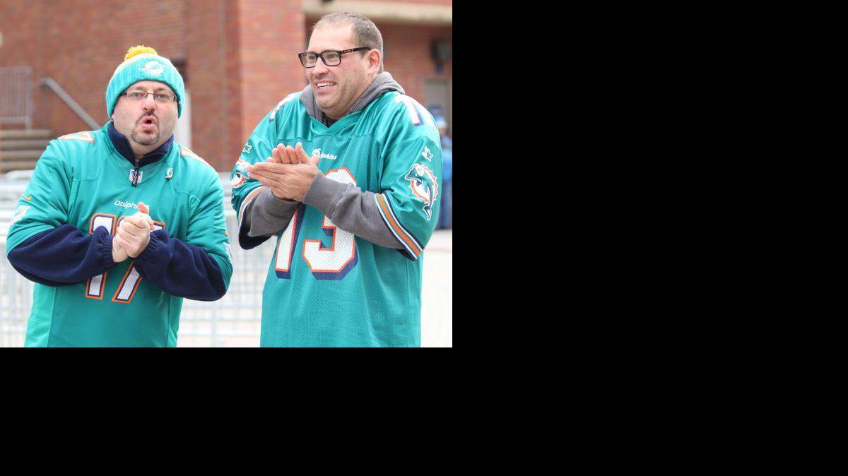 
Miami Dolphins fans wait in the chilly weather outside Ford Field as the fins prepare to play the Detroit Lions in Detroit, Michigan, November 9, 2014. Fans can expect temperatures in the 30s for Monday night's game against the Jets.
