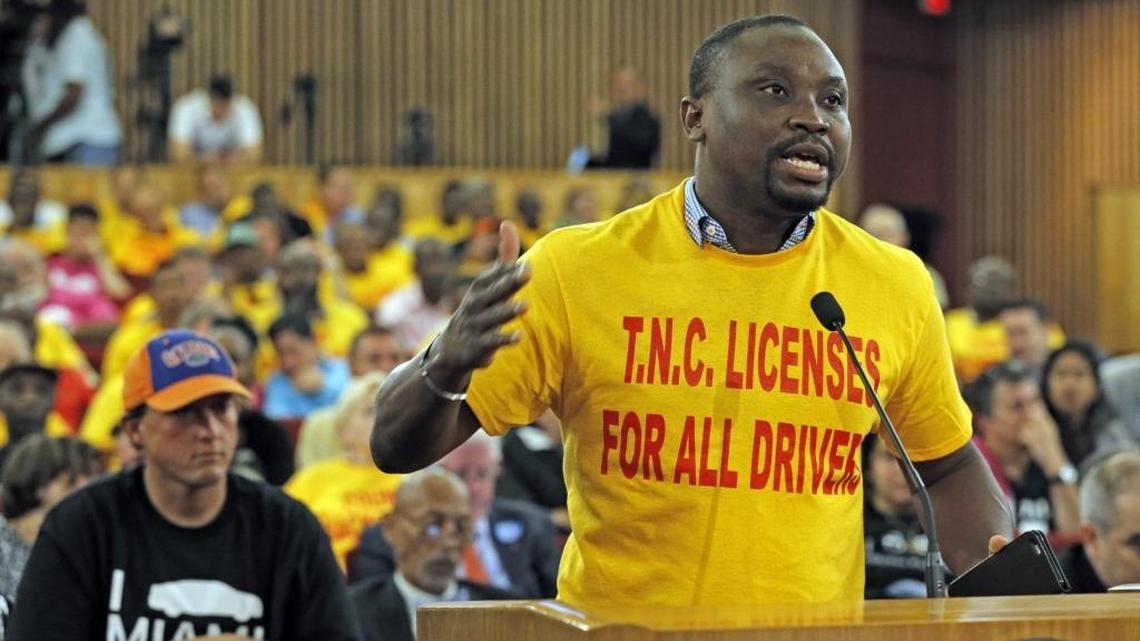 Jean Donald St. Louis speaks before the final vote in the Miami-Dade commission for legislation that would legalize Uber, Lyft and other ride-hailing services in the county on Tuesday, May 3, 2016.