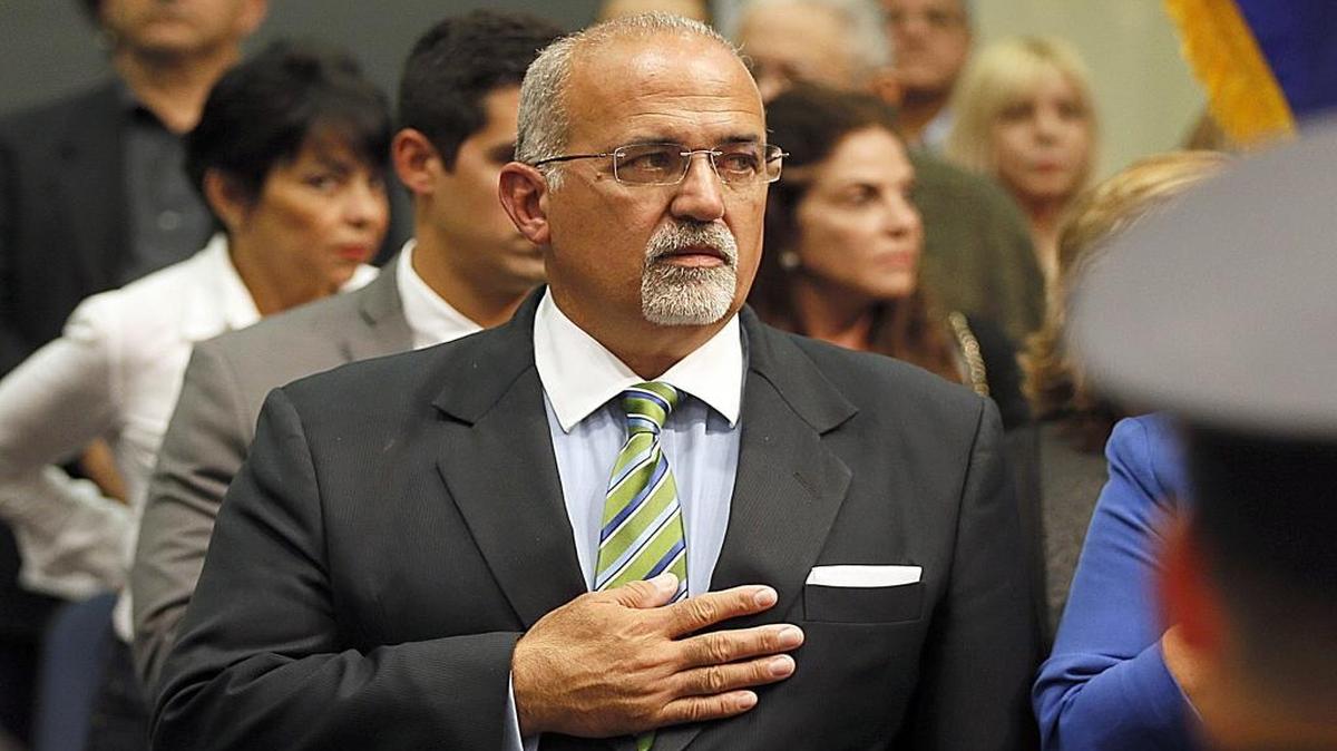 City of Doral councilman Pete Cabrera, salutes the colors during the swearing ceremony at City Hall, on Wednesday Nov. 5, 2014.