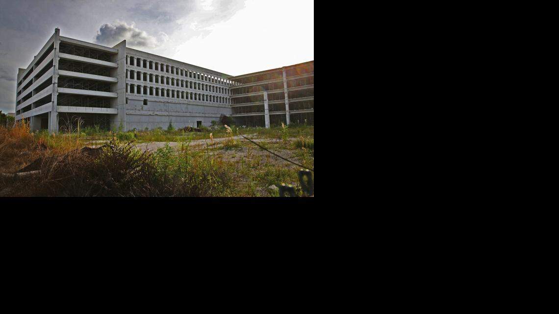 
Two years after a garage collapsed at Miami Dade College’s west campus in Doral, there is still no relief for the more than 6,000 students who attend the college there. The college has said its hands are tied due to litigation. Students either have to park at Miami International Mall and take a shuttle or find a spot along 117th Avenue, a public right-of-way, and walk. This is the vacant garage on Wednesday, October 8, 2014.
