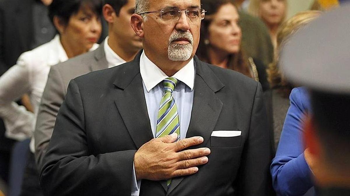 City of Doral councilman Pete Cabrera, salutes the colors during the swearing ceremony at City Hall, on Wednesday Nov. 5, 2014.