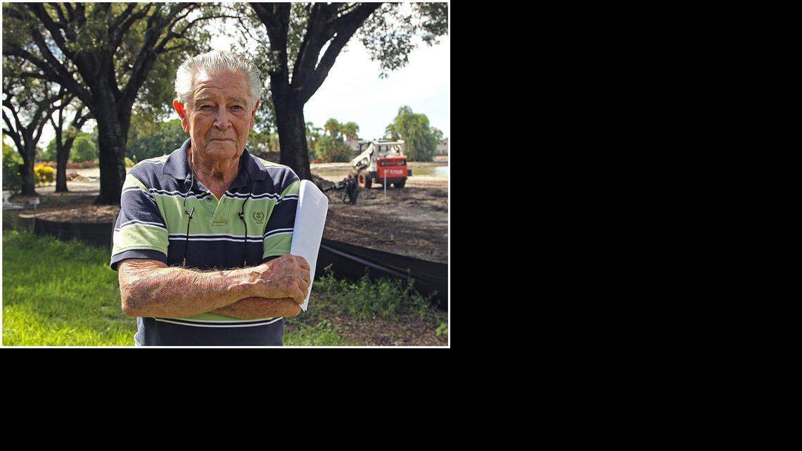 
Retiree Morgan Levy is fighting against the planting of palms near his property line that will obscure his view of the golf course. Areca palms were planted Monday on the several courses at the Trump National Doral Miami. 
