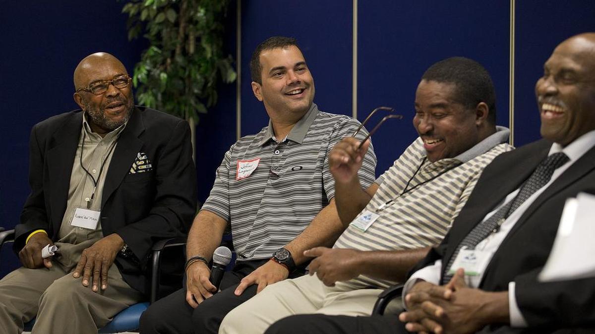 
Members of the Fatherhood Task Force (from left) Bob Mack, Jeffrey Lagomacini, Rique Franklin, Jr., and Johnny Orr talk about their roles as fathers and mentors at the premiere of a film titled Looking Ahead, which is about the importance of fathers being involved in their children's education.
