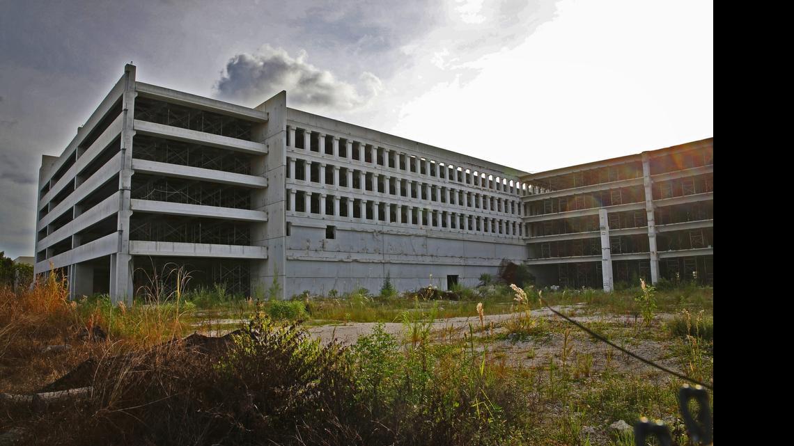 
The remains of a collapsed parking garage are being cleared and a new one will be built and ready in about 18 months.
