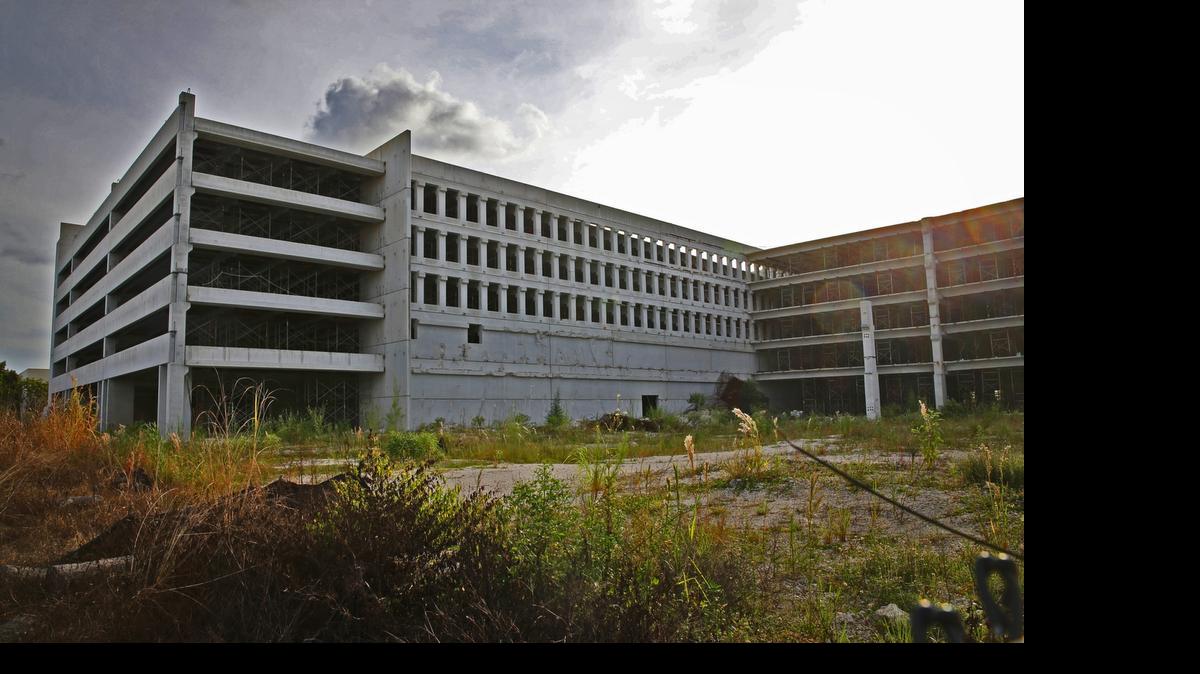 
The remains of a collapsed parking garage are being cleared and a new one will be built and ready in about 18 months.
