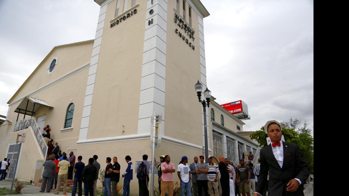 
Dozens wait outside the historic Mount Zion Baptist Church in Overtown to see Louis Farrakhan speak Wednesday, July 30, 2015.
