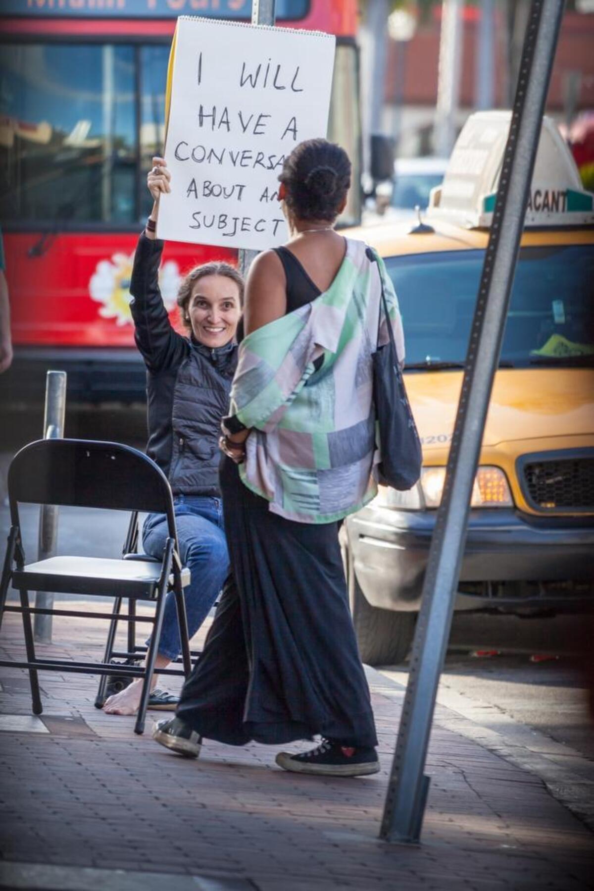Artist Eleonora Fabiao performs a piece on a Miami sidewalk in January as part of the Miami Dade College Museum of Art and Design’s Living Together series.