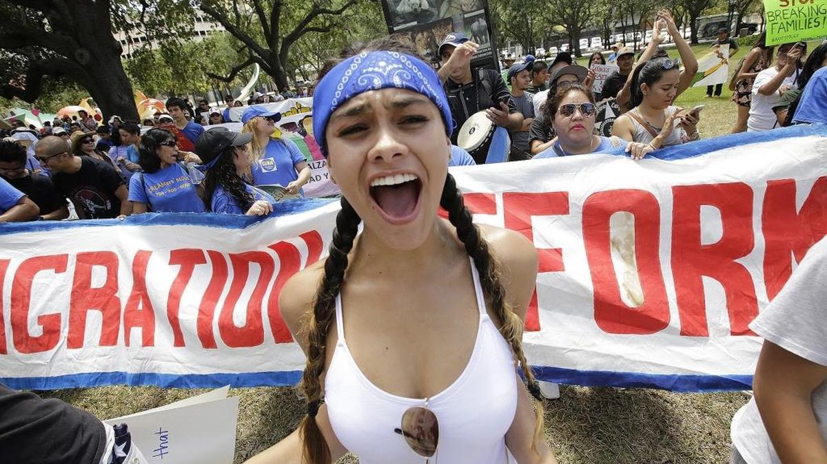 Natalia Hernandez marches in downtown Miami on Sunday, May 1, 2016, for a March Against Discrimination and Hate in commemoration of May Day, also known as International Workers’ Day.