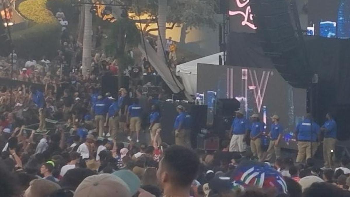 Security guards block the Monster Energy stage at the Rolling Loud music festival after the stage was shut down due to rowdy crowds.