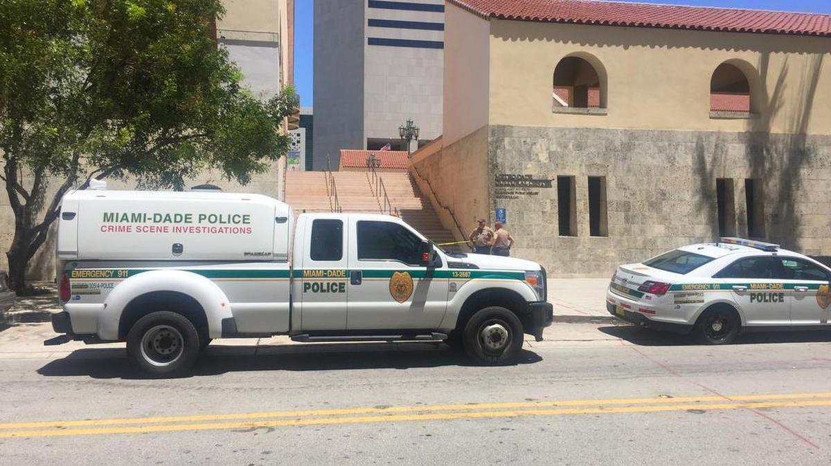 Miami-Dade police work the main Miami-Dade Public Library as a crime scene after Wednesday’s shooting.