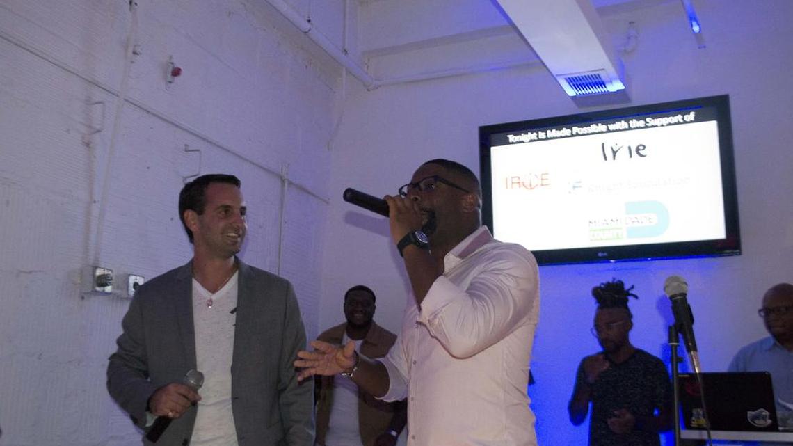 
Ian Welsch, left, and DJ Irie on stage giving thanks for the support and progress of the students. 
