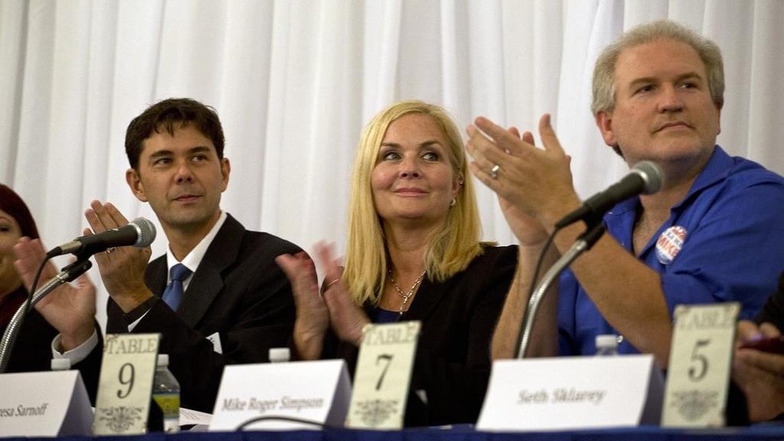
Teresa Sarnoff (center) sits between fellow candidates Ken Russell and Mike Roger Simpson, as she campaigns to claim the Miami Commission seat held by her term-limited husband Marc Sarnoff at a candidates forum at a Woman's Club of Coconut Grove.
