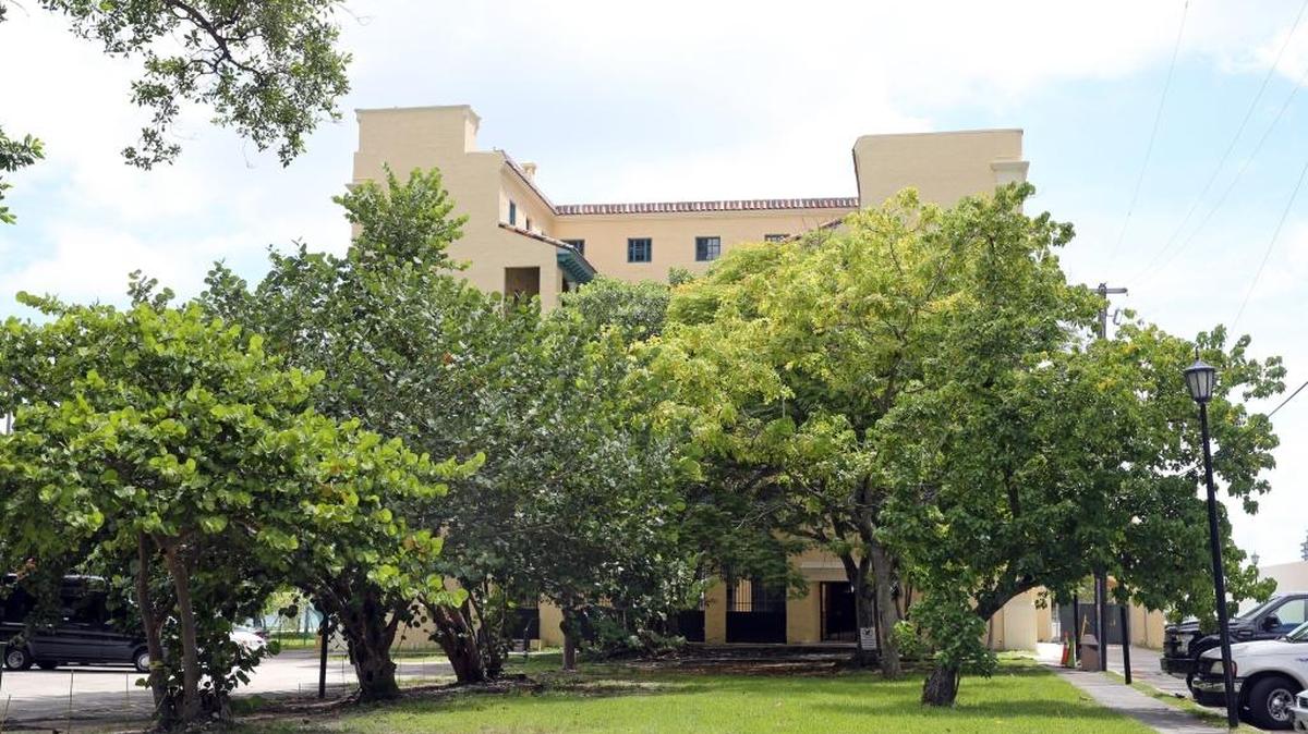 The Miami Women's Club, a historic building in downtown Miami near the Omni, is slated for renovation but the developer wants to cut down the old trees in front and expand the parking lot.