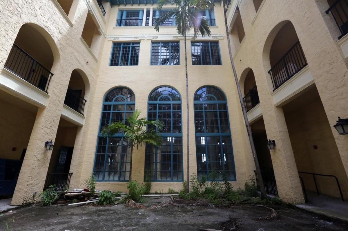 Miami Women's Club, a historic building in downtown Miami near the Omni, is slated for renovation but the developer wants to cut down the old trees in front and expand the parking lot.