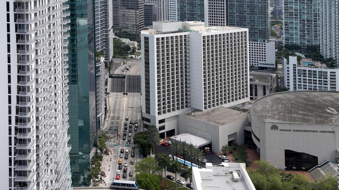 The Hyatt Regency looms over the Miami River to the west (right) side of Brickell Avenue. The James L. Knight Miami Convention Center is lower, and to the right.