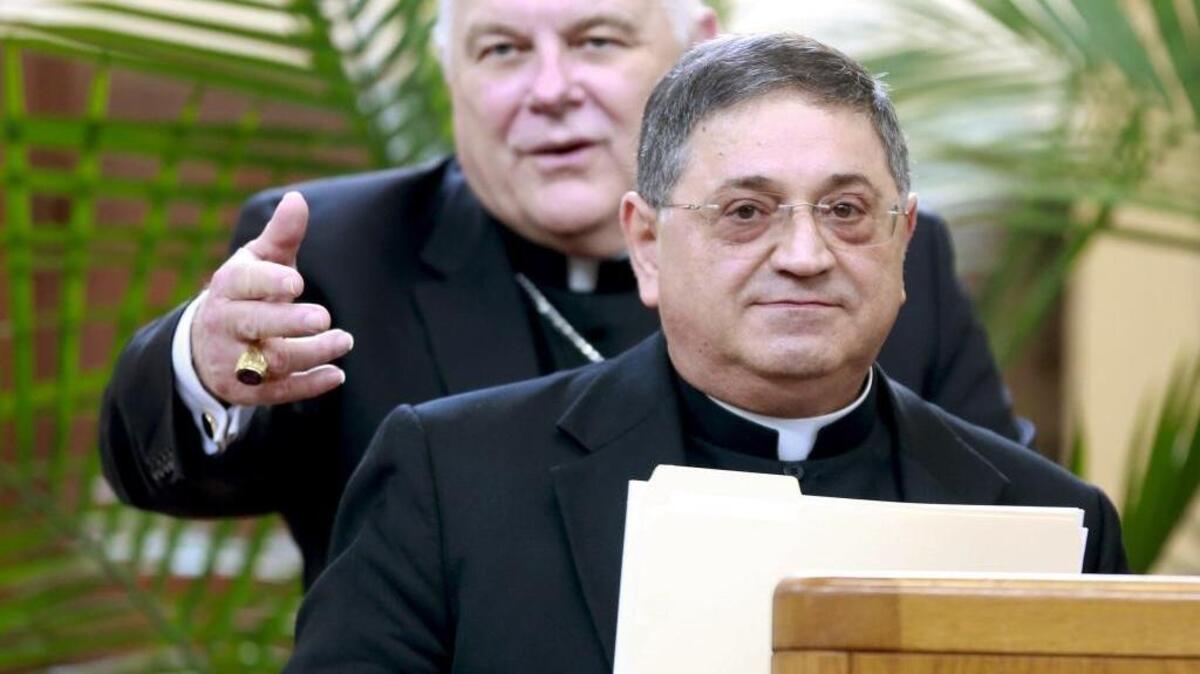 Archbishop Wenski, rear, introduces Vatican-appointed Auxiliary Bishop Enrique Delgado during a press conference at the Archdiocese of Miami on Thursday, October 12, 2017.
