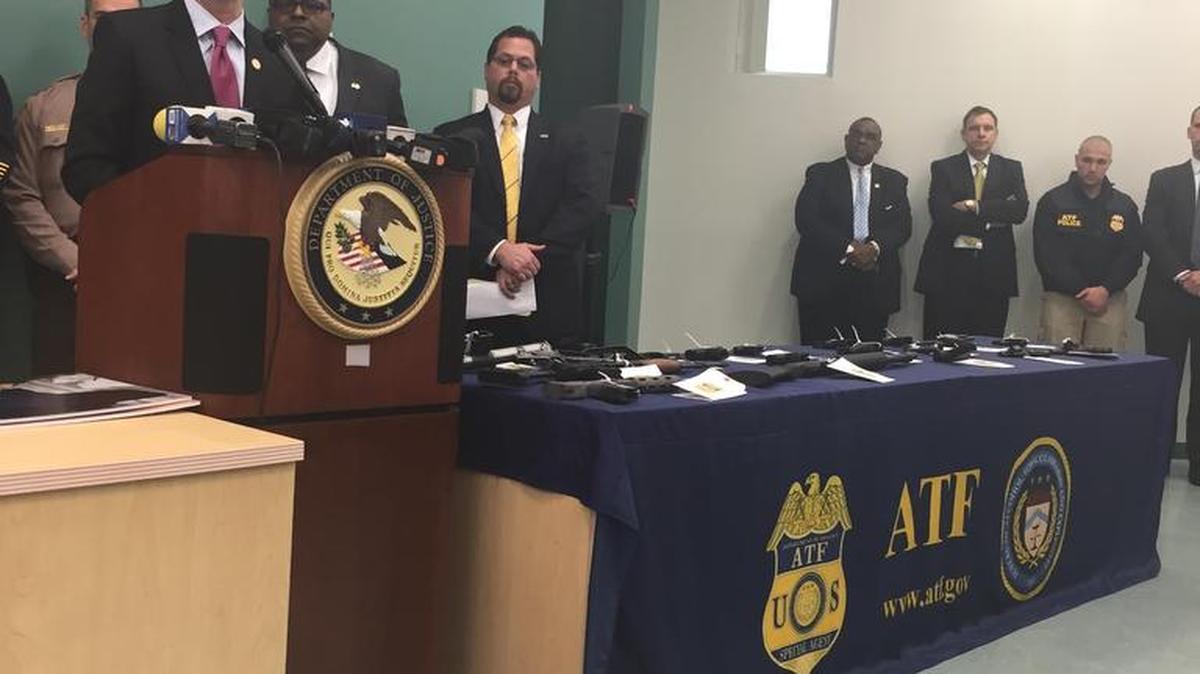 U.S. Attorney Wifredo Ferrer details drug-trafficking and firearm charges brought against 55 South Florida defendants during a news conference on Thursday at the Miami-Dade Police Department's station in Liberty City, one of the "hot spots" targeted by federal authorities.