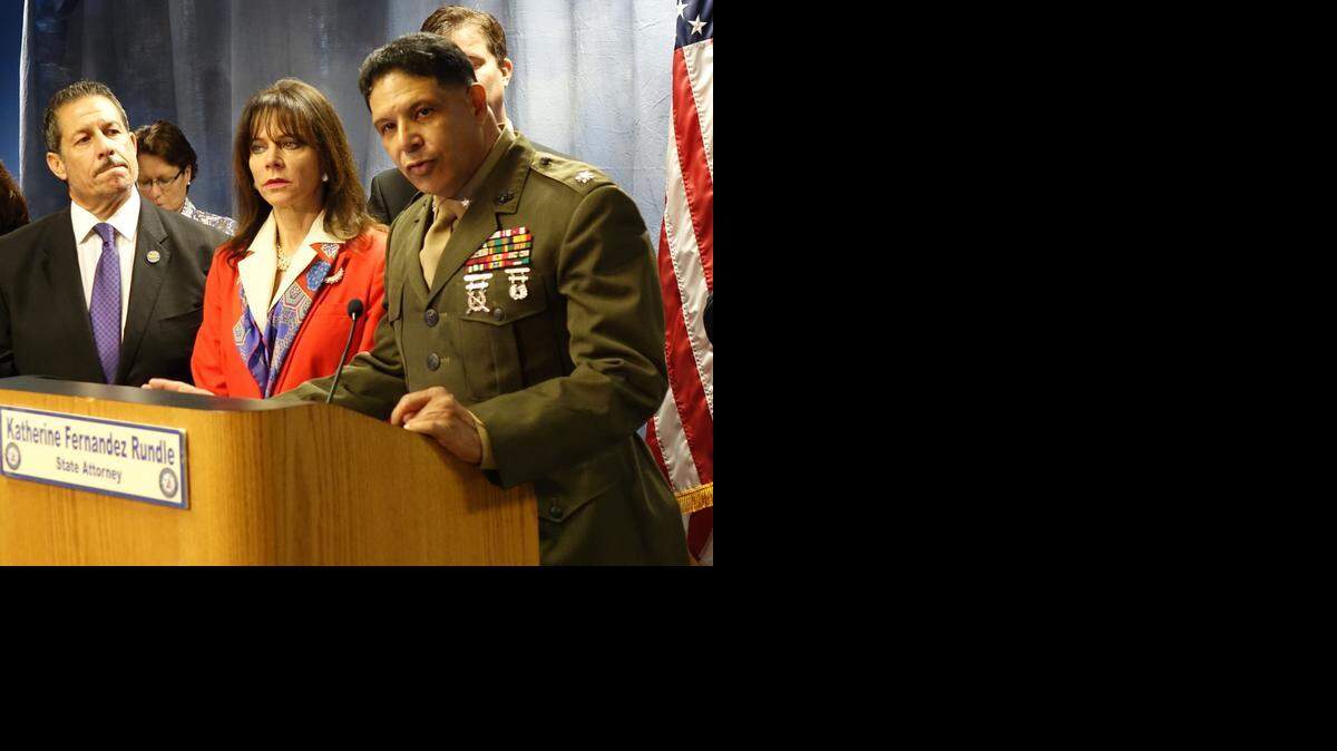 
Retired Marine Lt. Col Tony Colmenares, of Miami-Dade College, speaks Friday in announcing programs for veterans in the criminal justice system. At his left: Miami-Dade State Attorney Katherine Fernandez Rundle and County Commissioner Jose “Pepe” Diaz.
