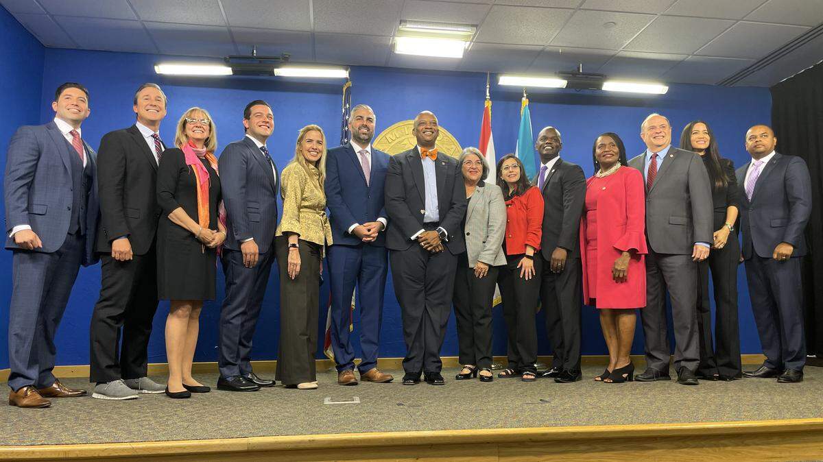 Photographed from left to right are: Commissioners Roberto Gonzalez and René Garcia, Miami Mayor Eileen Higgins and Ambassador Kevin Cabrera (both county commissioners at the time), Commissioner Raquel Regaldo, Commission Chair Anthony Rodriguez, Commissioner Oliver Gilbert, Mayor Levine Cava, Commissioners Micky Steinberg, Kionne McGhee, Marleine Bastien, Juan Carlos Bermudez, Danielle Cohen Higgins and Keon Hardemon. Not photographed are Commissioners Vicki Lopez and Natalie Milian Orbis, who were appointed to their seats in 2025.