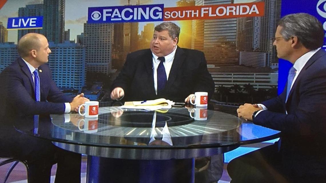 Jim DeFede, host of WFOR’s “Facing South Florida,” moderates a debate between state Sen. Miguel Diaz de la Portilla, right, and state Rep. José Javier Rodríguez, left.