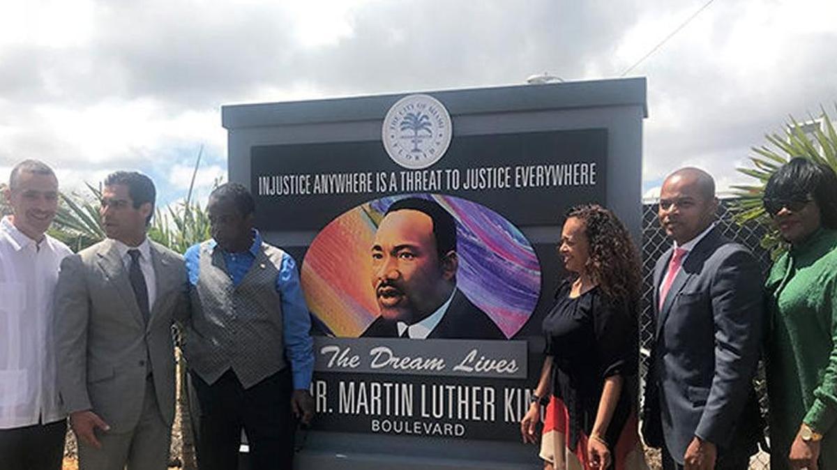 The city of Miami unveiled a new sign honoring Dr. Martin Luther King Jr. in April 2018. From left: Miami Public Works Director Juvenal Santana, Miami Mayor Francis Suarez, state Representative Roy Hardemon, MLKEDC Executive Director Christine King, Miami Commissioner Keon Hardemon and Director of Neighborhood Enhancement Team vonCarol Kinchens.