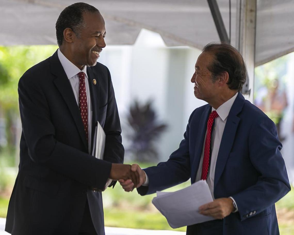 HUD Secretary Dr. Ben Carson shakes hands with Michael Liu, the director of Miami-Dade Public Housing and Community Development, during the grand opening of the first phase of the Liberty Square redevelopment in Miami’s Liberty City on Monday, July 1, 2019. When it first opened, Liberty Square was one of the top housing projects for black families in the country, but then it fell on hard times.