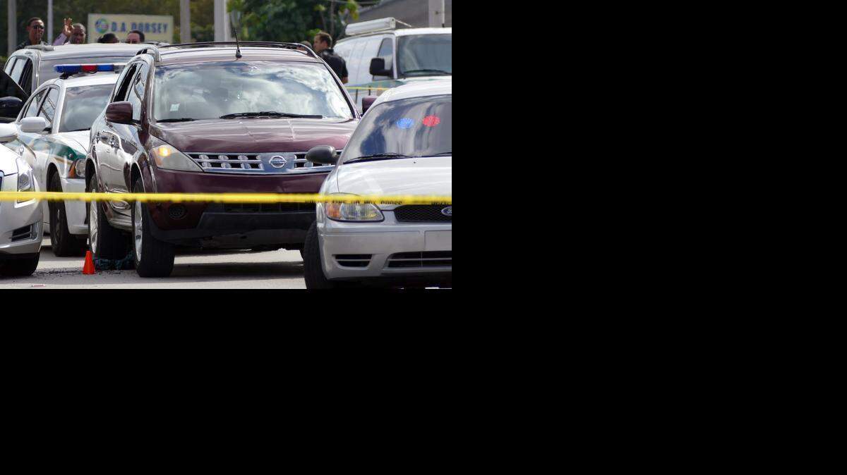 
Around 1:30 p.m. Tuesday, police stopped this Nissan Murano driven by Wadson Sagaille, 24, at a traffic stop at Northwest 17th Avenue and 73rd Street. Police said Sagaille, who had been attending a funeral procession for his brother before peeling away, reached for a gun. Miami-Dade police shot him. He was taken to Jackson Memorial Hospital with non-life-threatening injuries. Sagaille was wanted by Miami police for extortion, second-degree murder with a deadly weapon and assault with a deadly weapon. The Murano has a bullet hole in the front windshield.
