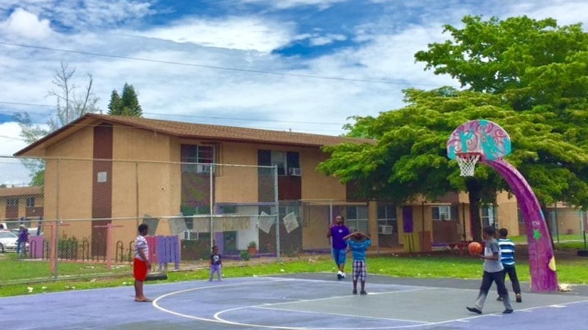 None of the lights have worked for years on the basketball courts at the Annie Coleman public housing project in Liberty City.