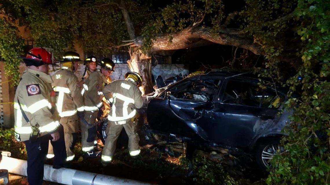 An Infinity burst into flames after hitting a tree on the corner of Northwest 12th Avenue and 53rd Street in Model City Monday night. The driver of the car died, as did a bicyclist, whom Miami police say the driver hit before crashing. Police said the car was stolen out of the Sunny Isles Police Department’s jurisdiction.
